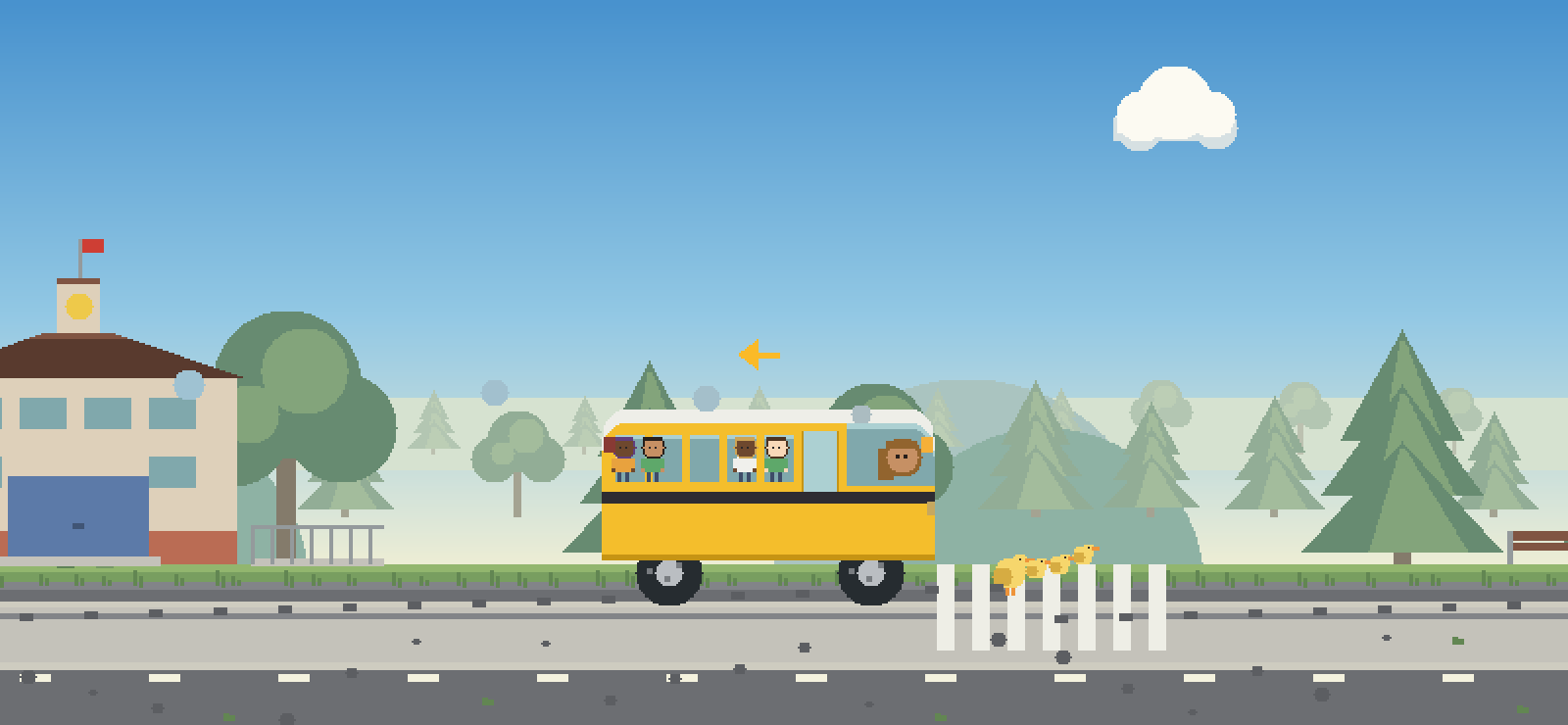 A school bus waiting while a family of ducks crosses the road.